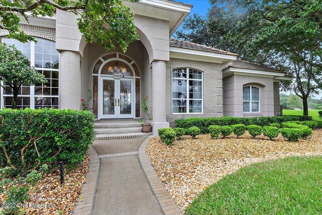 property entrance featuring french doors