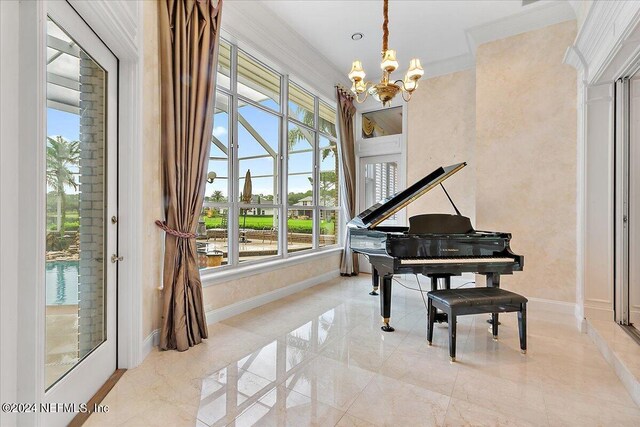 living area featuring ornamental molding and a chandelier