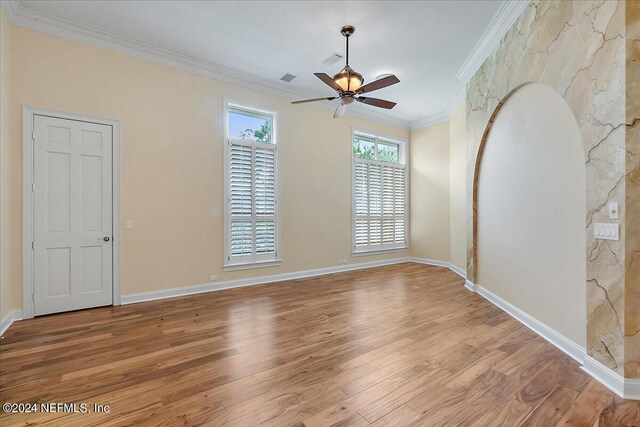 unfurnished room with ornamental molding, hardwood / wood-style floors, and ceiling fan