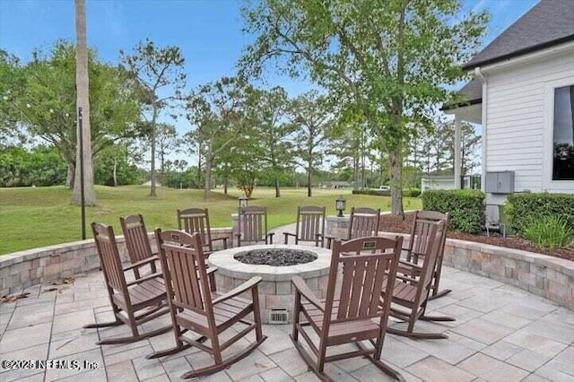 view of patio / terrace with an outdoor fire pit