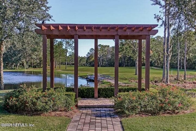 surrounding community featuring a water view, a yard, and a pergola