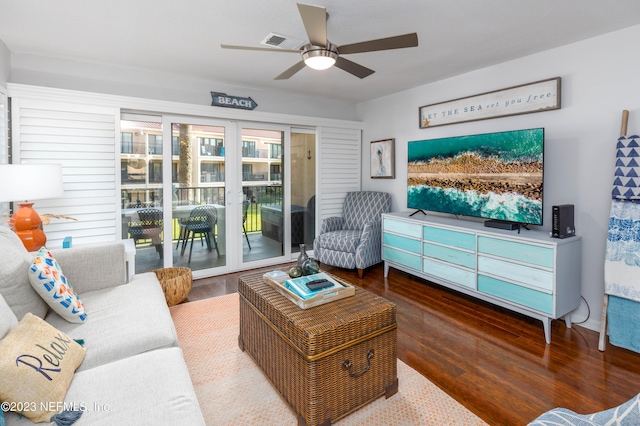 living room featuring hardwood / wood-style floors and ceiling fan