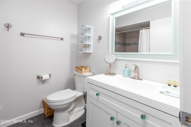 bathroom with vanity, toilet, curtained shower, and wood-type flooring