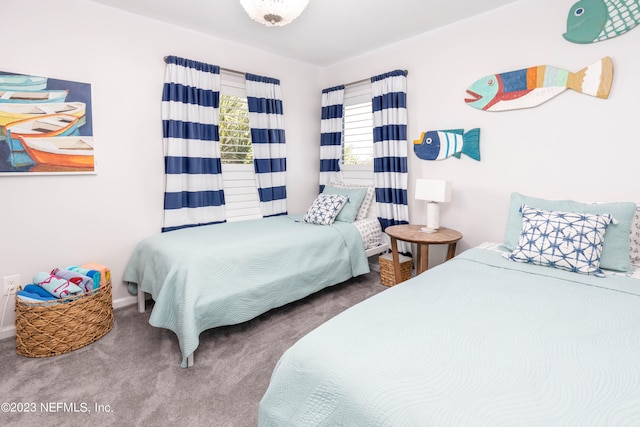 bedroom featuring dark colored carpet