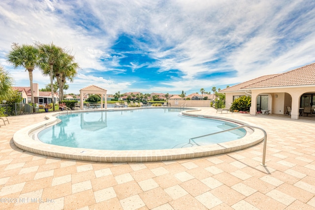 view of pool with a patio area and a gazebo