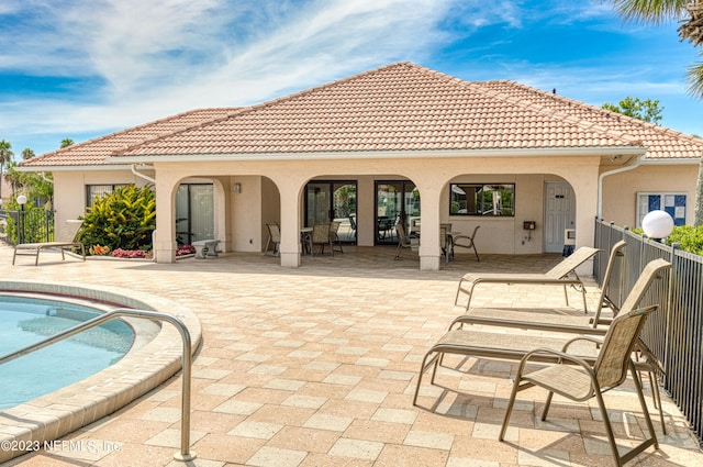 back of property with a patio