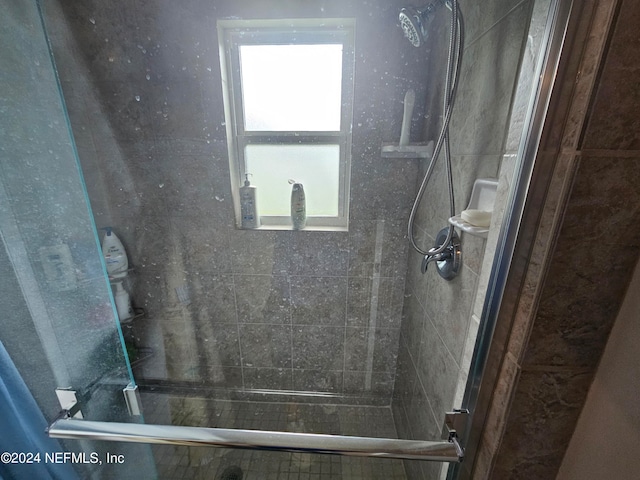 bathroom featuring an enclosed shower