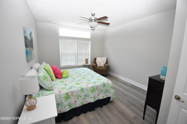 bedroom featuring ceiling fan and hardwood / wood-style floors