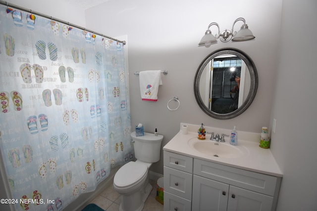 full bathroom featuring vanity, shower / bath combo with shower curtain, toilet, and tile patterned floors