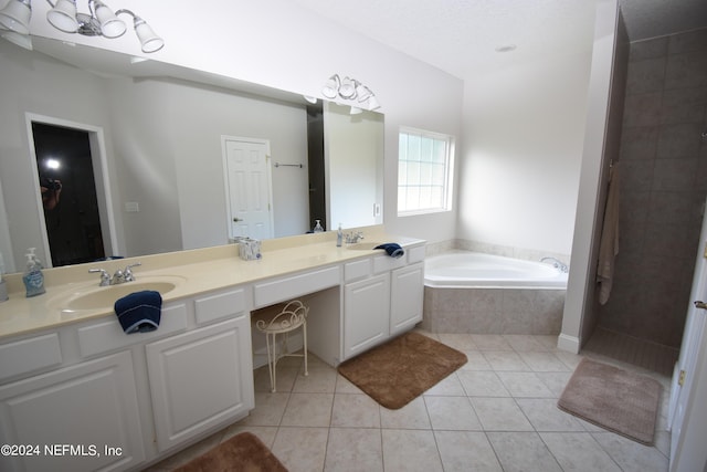 bathroom featuring tile patterned flooring, vanity, and plus walk in shower