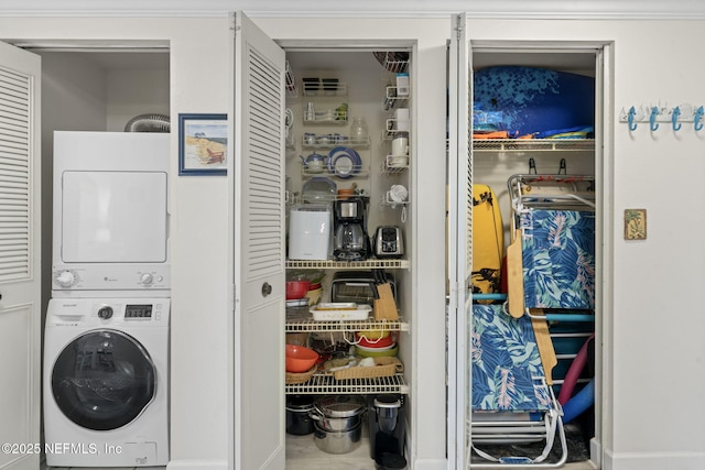 laundry room featuring stacked washer and clothes dryer