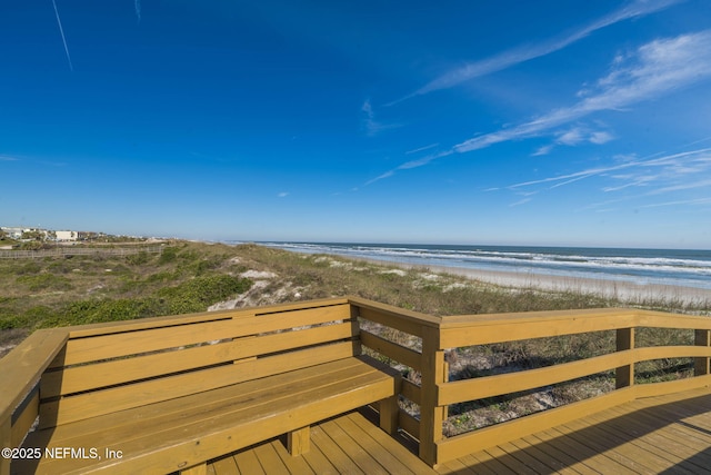 view of home's community featuring a view of the beach and a water view