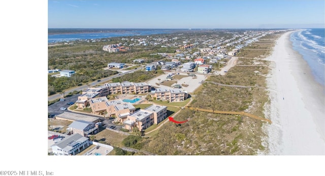 bird's eye view with a water view and a view of the beach