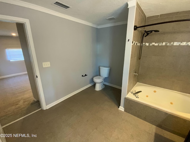 bathroom featuring crown molding, a combined bath / shower with jetted tub, visible vents, toilet, and baseboards