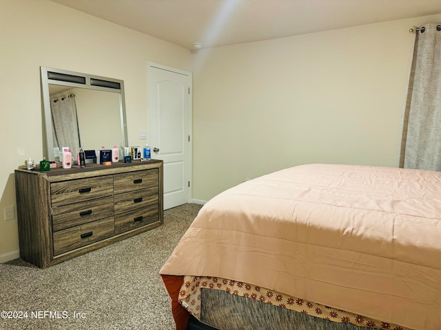 bedroom featuring carpet