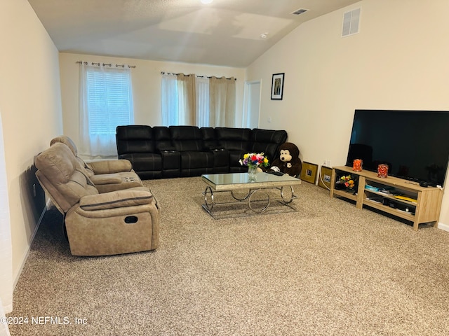 living room with carpet and vaulted ceiling