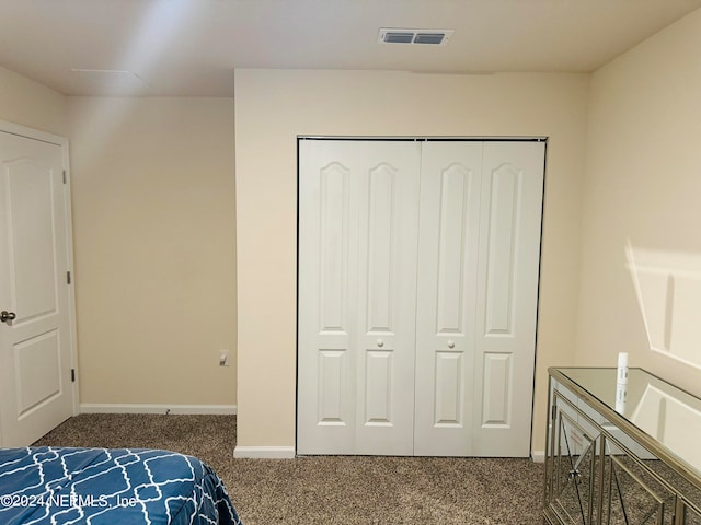 carpeted bedroom featuring a closet