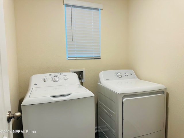 laundry room with washing machine and dryer