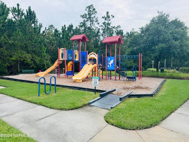 view of play area featuring a lawn