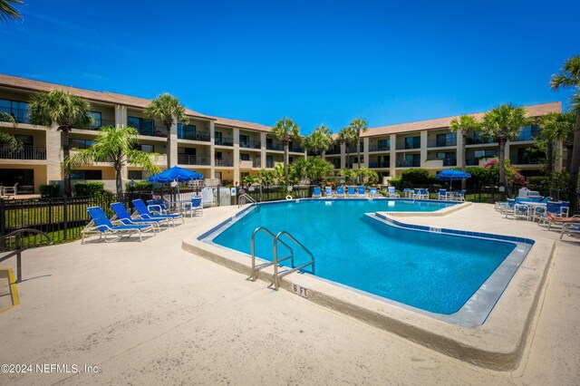 view of swimming pool with a patio