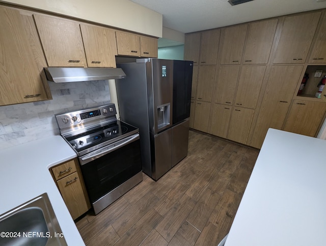 kitchen with light brown cabinets, backsplash, dark hardwood / wood-style floors, and stainless steel appliances