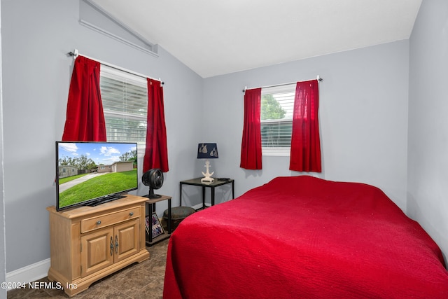 bedroom featuring vaulted ceiling