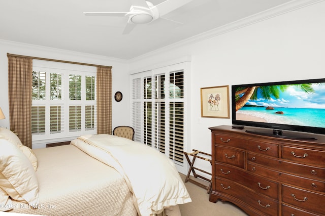 carpeted bedroom featuring ceiling fan, multiple windows, and crown molding