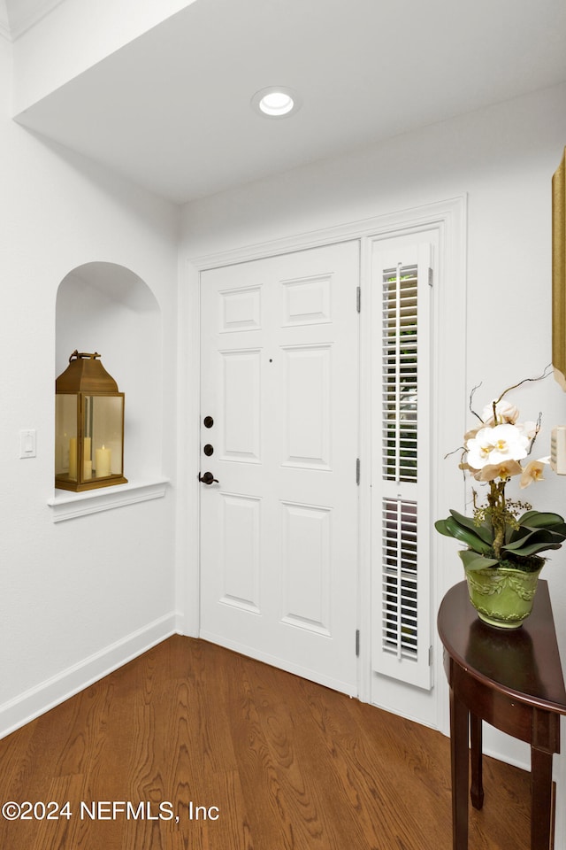 entrance foyer featuring dark hardwood / wood-style floors