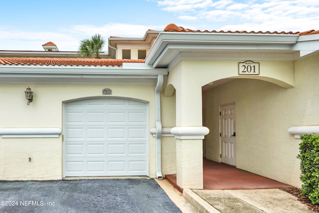 entrance to property featuring a garage