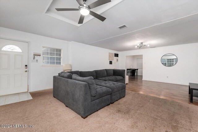 living room with hardwood / wood-style flooring and ceiling fan