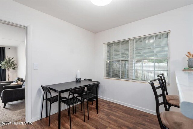 dining space featuring dark hardwood / wood-style flooring