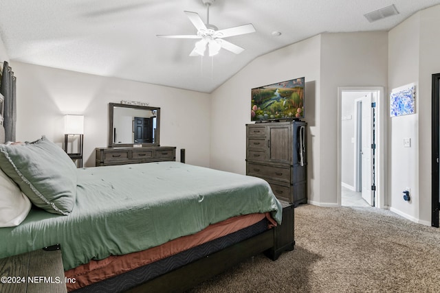 bedroom with carpet floors, lofted ceiling, and ceiling fan