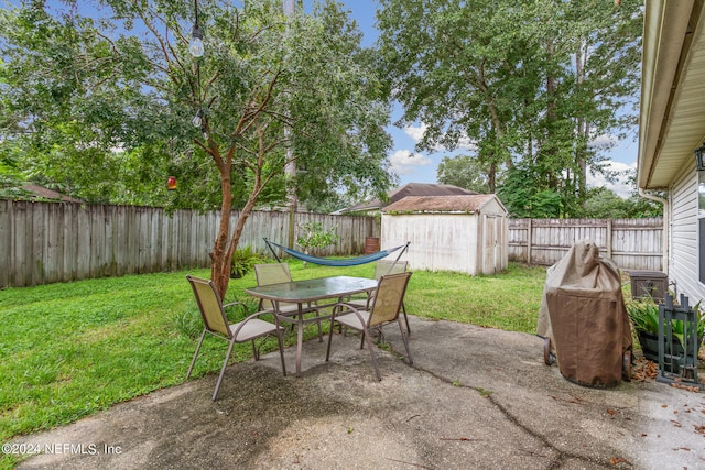 view of patio with a storage unit