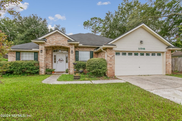 single story home with a garage and a front yard