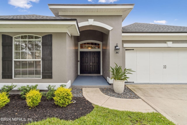 property entrance with a garage