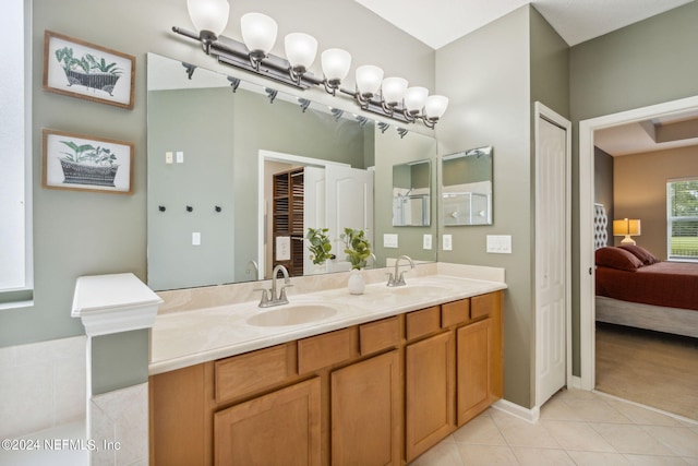 bathroom with tile patterned flooring and vanity