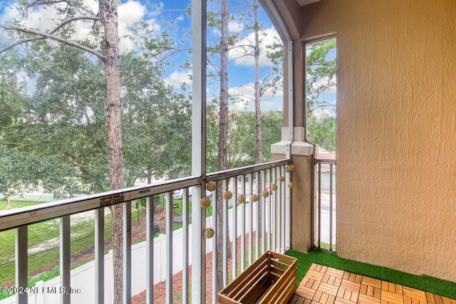 unfurnished sunroom featuring a healthy amount of sunlight