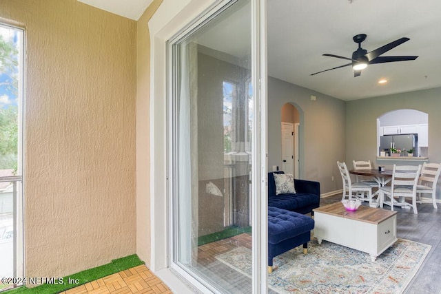 interior space with ceiling fan