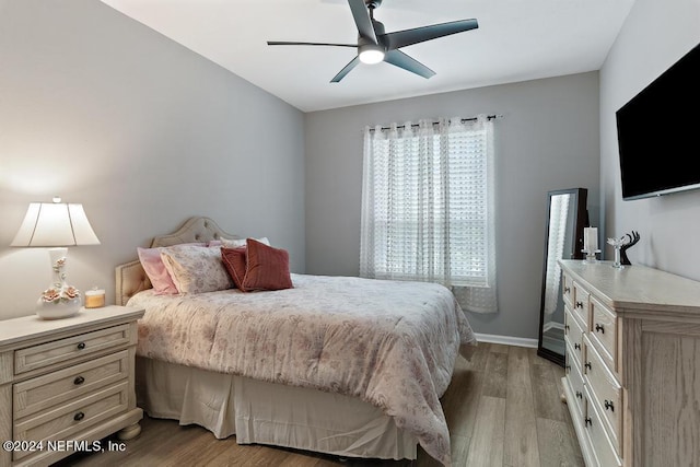 bedroom featuring ceiling fan and light hardwood / wood-style floors