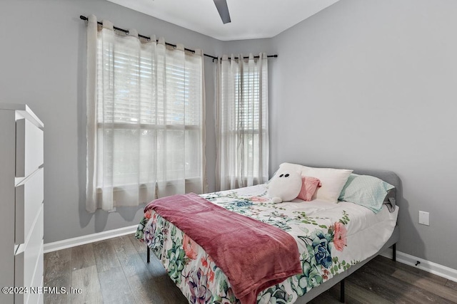 bedroom featuring dark wood-type flooring and ceiling fan