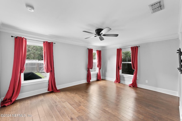 unfurnished room with crown molding, hardwood / wood-style floors, and ceiling fan