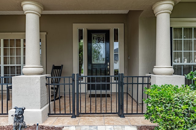 property entrance with covered porch