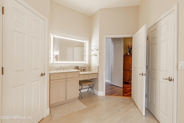 bathroom featuring vanity and hardwood / wood-style floors