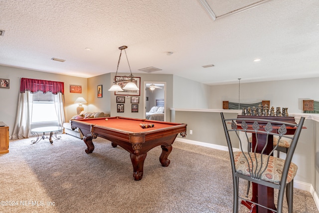 recreation room featuring a textured ceiling, pool table, and carpet flooring