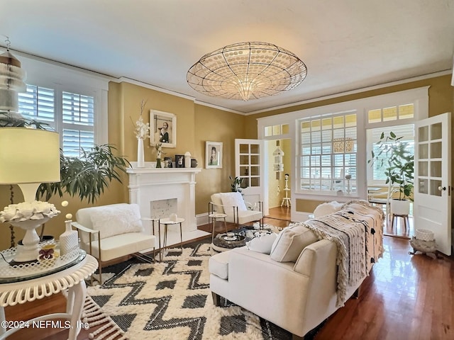 living room with plenty of natural light, ornamental molding, french doors, and hardwood / wood-style flooring