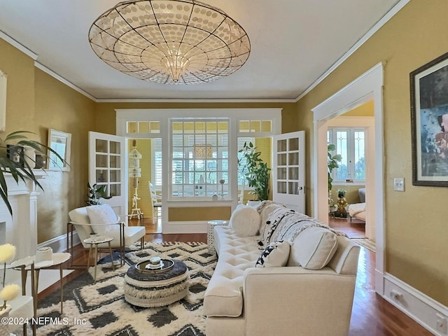 interior space featuring ornamental molding, hardwood / wood-style floors, and french doors