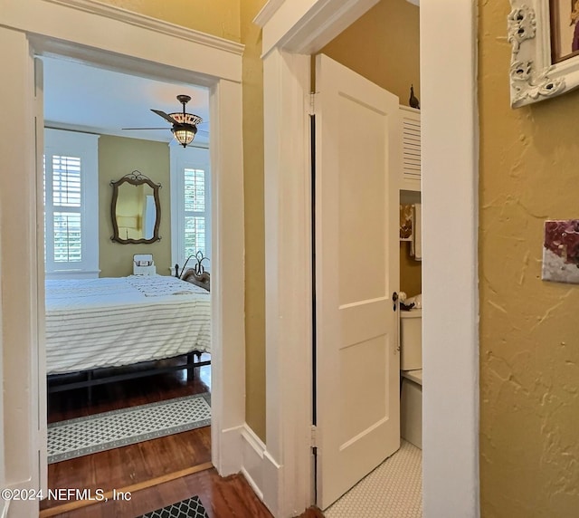 bedroom featuring wood-type flooring and ceiling fan