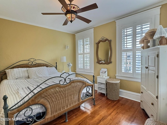 bedroom with ceiling fan and wood-type flooring