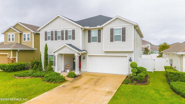 view of front of house featuring a garage and a front yard