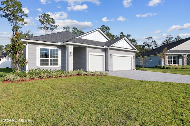 ranch-style home featuring a front yard and a garage